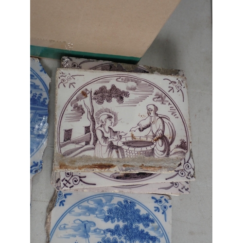 286 - A Box of Tiles including some Delft, decorated with country scenes and a quantity of diamond shaped ... 