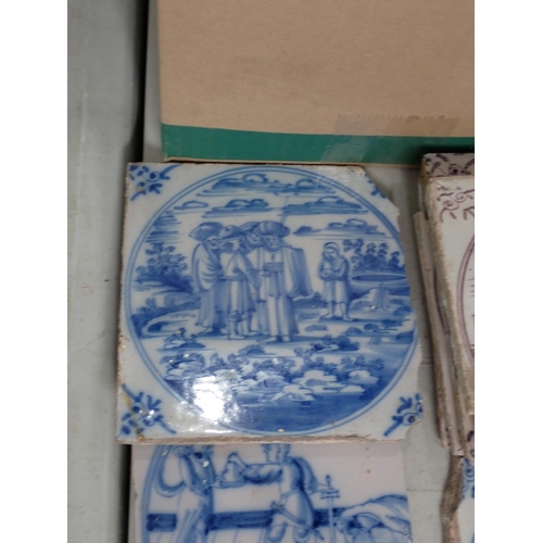 286 - A Box of Tiles including some Delft, decorated with country scenes and a quantity of diamond shaped ... 