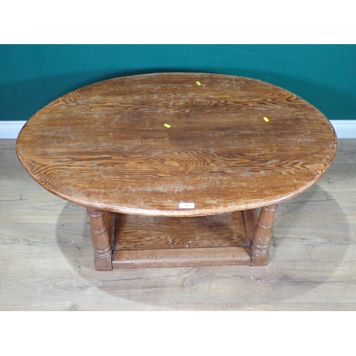 307 - An oval oak two tier Coffee Table 3ft 10in W x 1ft 6in H