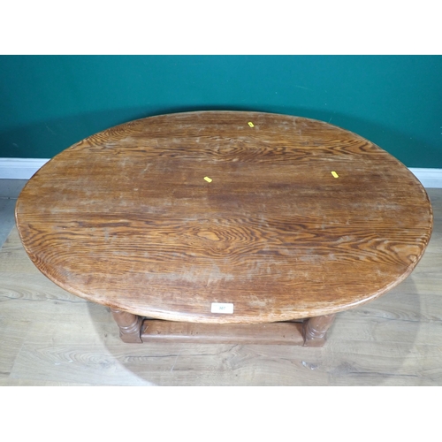 307 - An oval oak two tier Coffee Table 3ft 10in W x 1ft 6in H