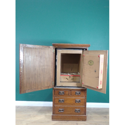 323 - An oak Safe Case with mirror door above two short and two long drawers 4ft 3in H x 2ft W and a Birmi... 