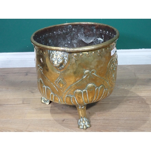 328 - A 19th Century copper Log Bin with lion mask handles mounted on three paw feet 1ft 5in D x 1ft 3in H