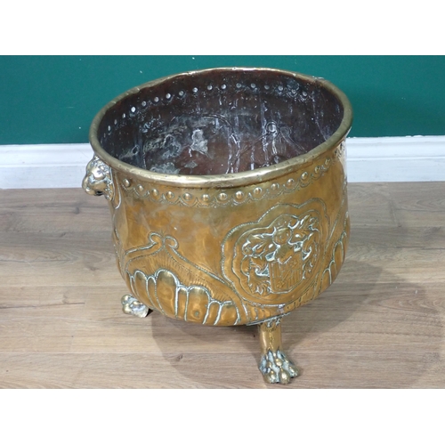 328 - A 19th Century copper Log Bin with lion mask handles mounted on three paw feet 1ft 5in D x 1ft 3in H