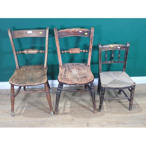 333 - Two antique elm Oxford type Kitchen Chairs and a child's rush seated Chair, woodworm