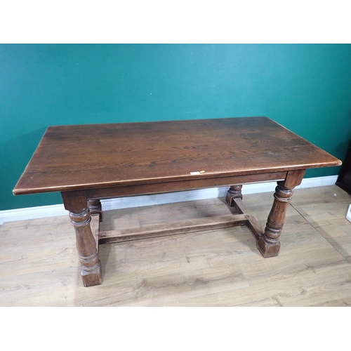 335 - A reproduction oak Refectory Table on turned supports and H stretcher, 5ft 7