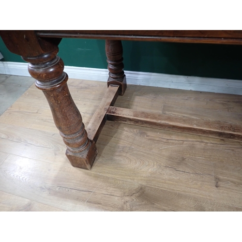 335 - A reproduction oak Refectory Table on turned supports and H stretcher, 5ft 7