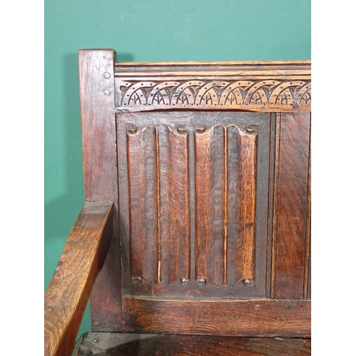 361 - An antique oak Bench in the 17th Century with linenfold and diamond carved four panel back mounted u... 