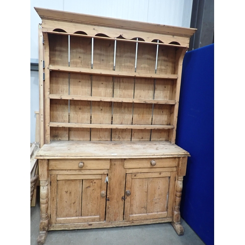 479 - A 19th Century pine Irish Dresser and Rack fitted two frieze drawers above pair of cupboard doors to... 