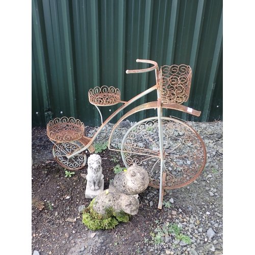 594 - A metal Penny Farthing three tier Plant Stand, two Cat garden Figures and a Lion Figure.