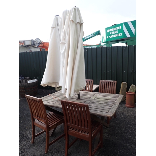 597 - A wooden Garden Table and Parasol and a set of four Westminster Teak Garden Chairs.