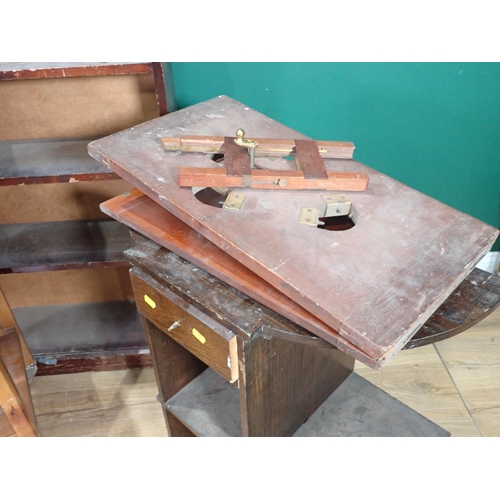 67 - A mahogany Bed Tray, a Bookcase, a Tea Trolley, oak Bookcase and a Press