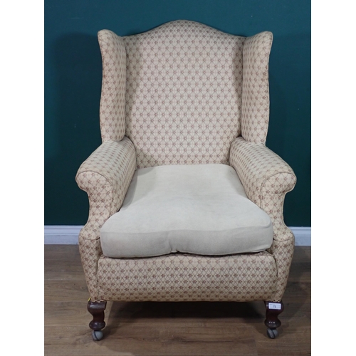 72 - An antique winged Armchair on cabriole front supports and casters 3ft 8in H x 2ft 8in W