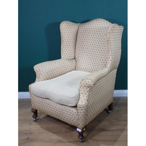 72 - An antique winged Armchair on cabriole front supports and casters 3ft 8in H x 2ft 8in W