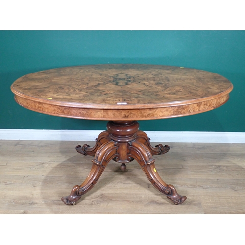 85 - A Victorian walnut veneered oval Breakfast Table on turned column and four carved splayed supports, ... 