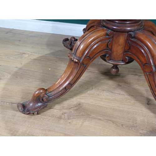 85 - A Victorian walnut veneered oval Breakfast Table on turned column and four carved splayed supports, ... 