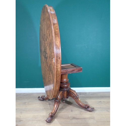 85 - A Victorian walnut veneered oval Breakfast Table on turned column and four carved splayed supports, ... 