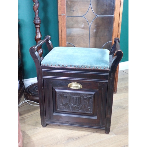 93 - An oak and lead glazed Bookcase, an oak canted Cupboard, a barley twist Standard Lamp and shade (pas... 