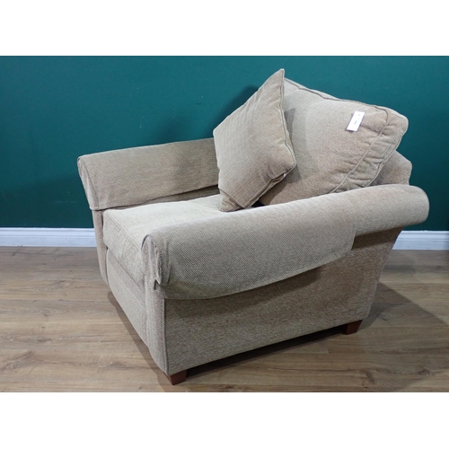 58 - A beige upholstered Armchair