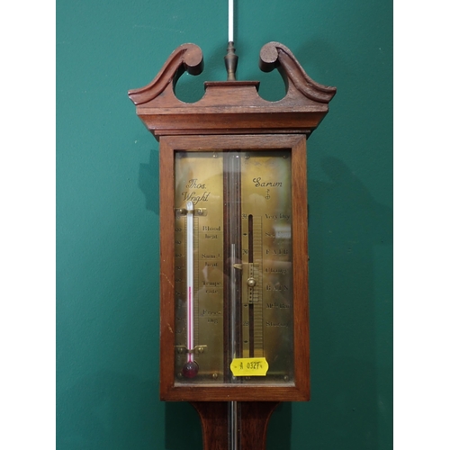 295 - A mahogany stick case barometer by Thos Wright, a cuckoo clock, two bags of floral material