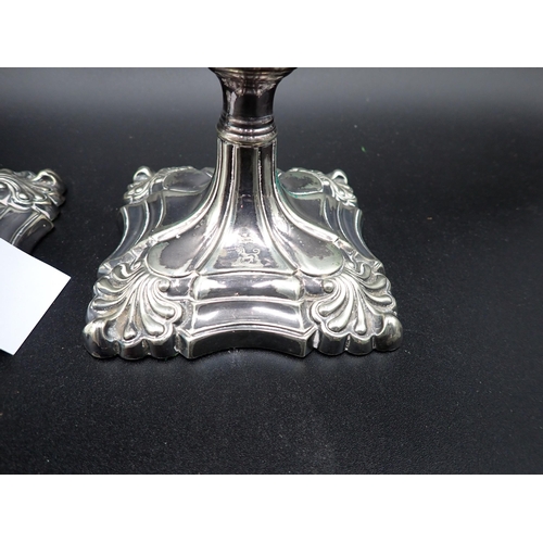 117 - A pair of plated Pillar Candlesticks with knopped stems, engraved dog crests with coronet, 9in, a pl... 