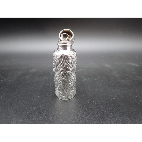 119 - A Victorian silver cylindrical Scent Bottle with scroll embossing, hinged lid and stopper, Birmingha... 