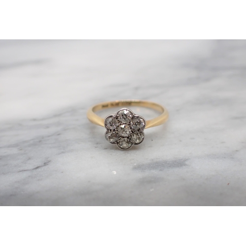 156 - A Diamond Cluster Ring pavé-set seven old-cut stones, stamped PLAT & 18ct, ring size P