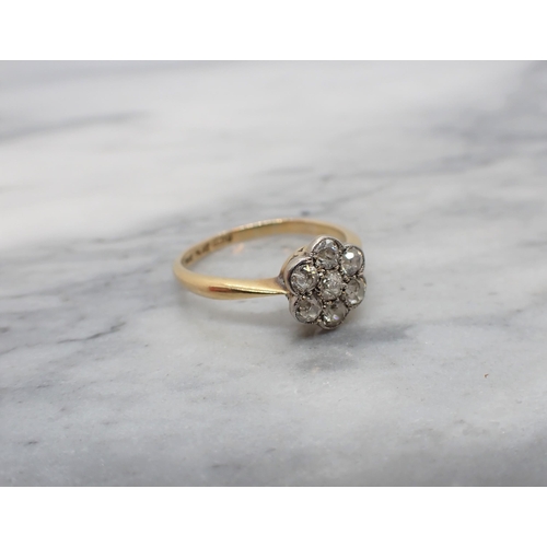 156 - A Diamond Cluster Ring pavé-set seven old-cut stones, stamped PLAT & 18ct, ring size P