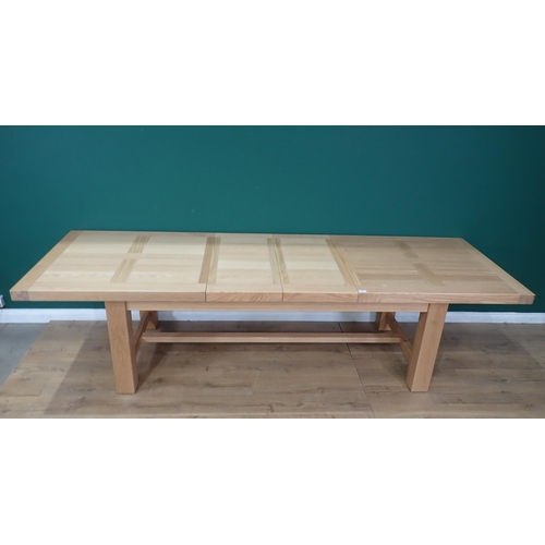 16 - A large modern oak Dining Table on square supports labelled Corndell Furniture 7' 3