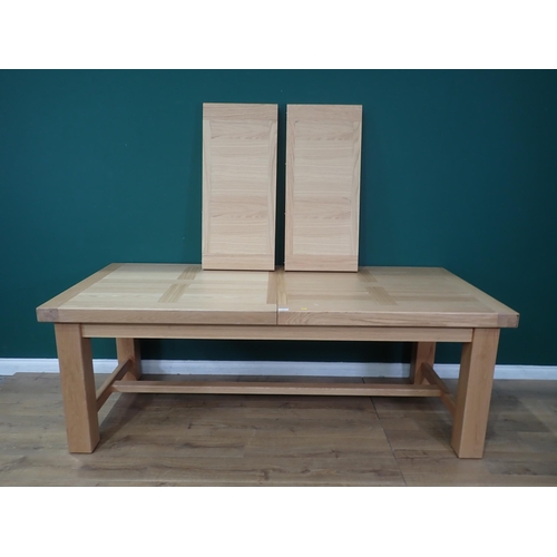 16 - A large modern oak Dining Table on square supports labelled Corndell Furniture 7' 3