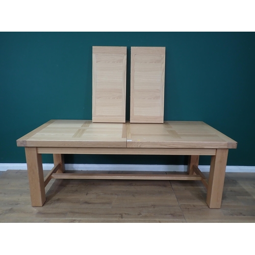 16 - A large modern oak Dining Table on square supports labelled Corndell Furniture 7' 3