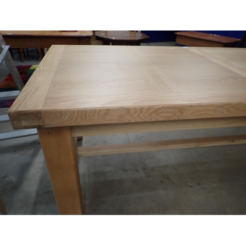 16 - A large modern oak Dining Table on square supports labelled Corndell Furniture 7' 3