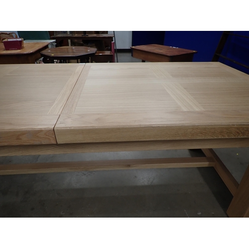 16 - A large modern oak Dining Table on square supports labelled Corndell Furniture 7' 3