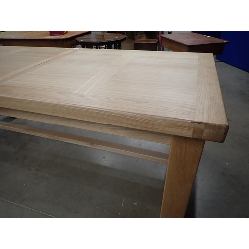 16 - A large modern oak Dining Table on square supports labelled Corndell Furniture 7' 3