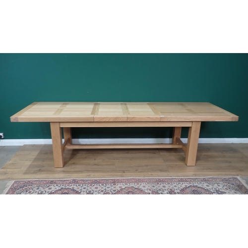 16 - A large modern oak Dining Table on square supports labelled Corndell Furniture 7' 3