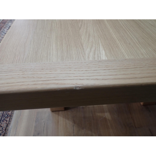 16 - A large modern oak Dining Table on square supports labelled Corndell Furniture 7' 3