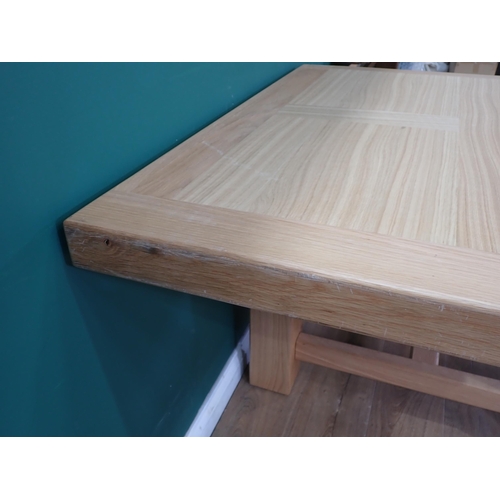 16 - A large modern oak Dining Table on square supports labelled Corndell Furniture 7' 3