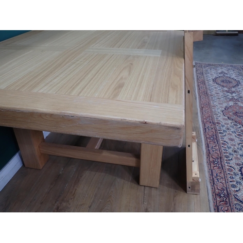 16 - A large modern oak Dining Table on square supports labelled Corndell Furniture 7' 3