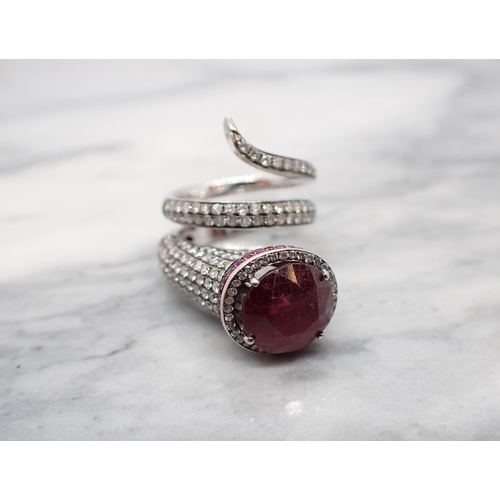 160 - A gem-set Snake Cocktail Ring claw-set oval-cut glass filled ruby within a frame of brilliant-cut di... 