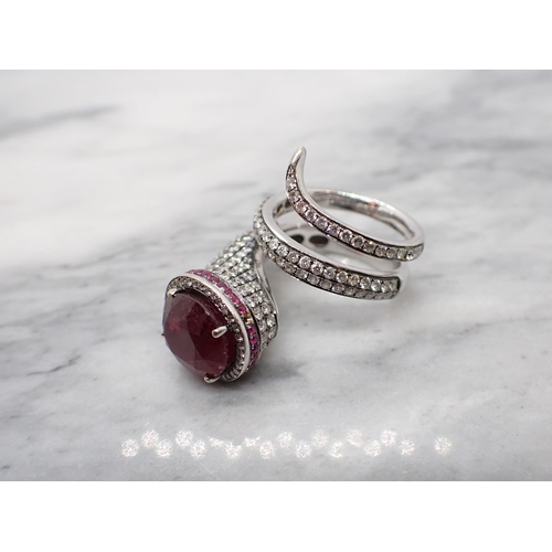 160 - A gem-set Snake Cocktail Ring claw-set oval-cut glass filled ruby within a frame of brilliant-cut di... 