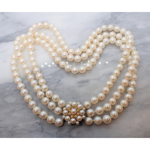 176 - A three row Cultured Pearl Choker on 9ct gold clasp set pearls