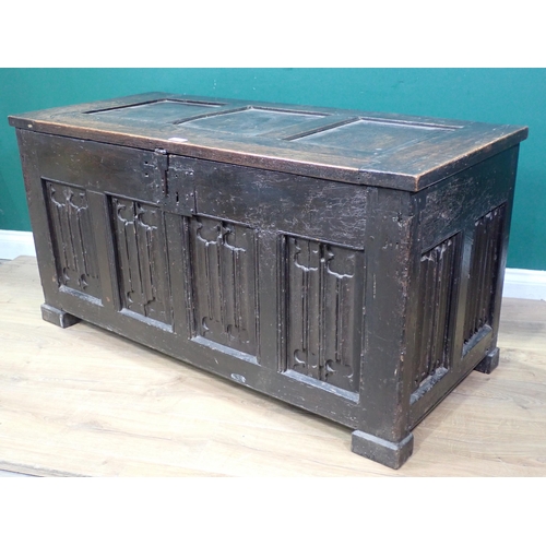 21 - A 16th Century and later oak Coffer with sunken three panel lid above four linenfold panels on front... 