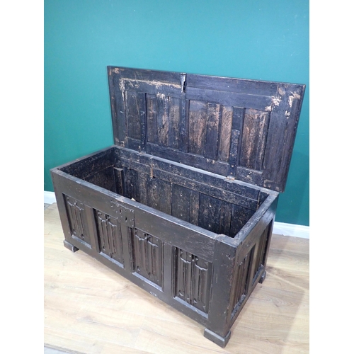 21 - A 16th Century and later oak Coffer with sunken three panel lid above four linenfold panels on front... 