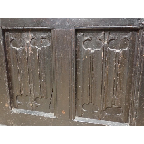 21 - A 16th Century and later oak Coffer with sunken three panel lid above four linenfold panels on front... 