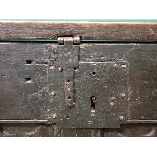 21 - A 16th Century and later oak Coffer with sunken three panel lid above four linenfold panels on front... 