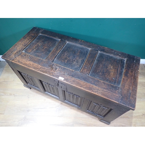 21 - A 16th Century and later oak Coffer with sunken three panel lid above four linenfold panels on front... 