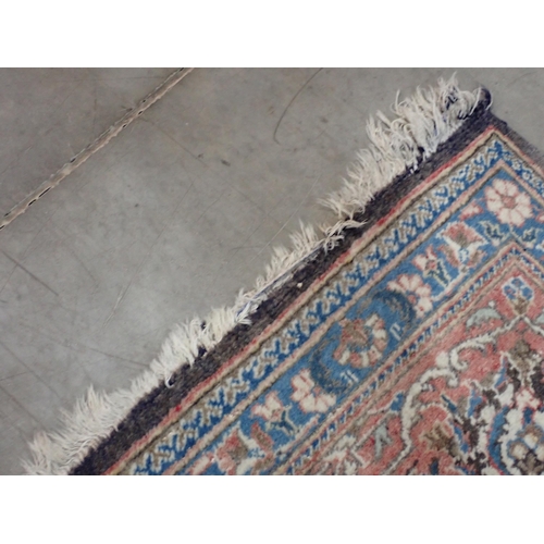 22 - A large Persian multi bordered Rug on red and blue ground with central floral motif 11ft L x 7ft 9in... 