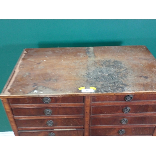 307 - A 19th Century mahogany bank of Twenty Two graduated Drawers, with ring handles and crossbanded deco... 