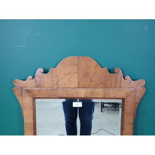 31 - An antique Georgian Style walnut framed Mirror, with later bevelled plate, 3ft 8