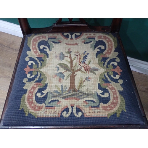 38 - An antique mahogany pierced splat back Single Chair, two antique Cushions one with figures and birds... 