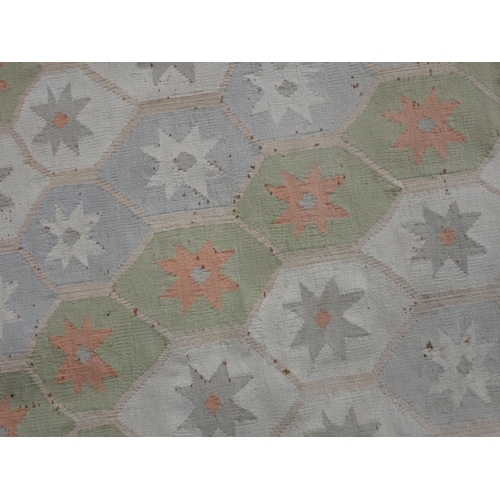 41 - A Kelim Rug on cream ground with geometric border and large central diamond motif, A/F. 7ft 4